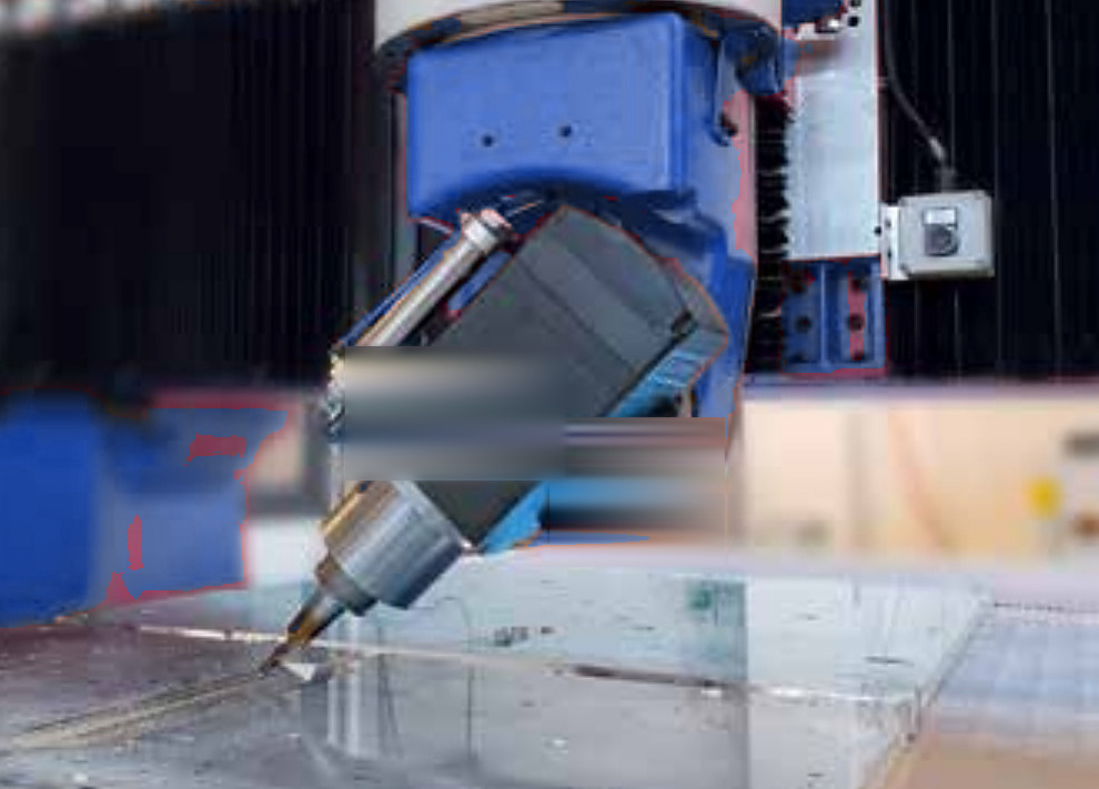 Waterjet cutting head detail on a working table
